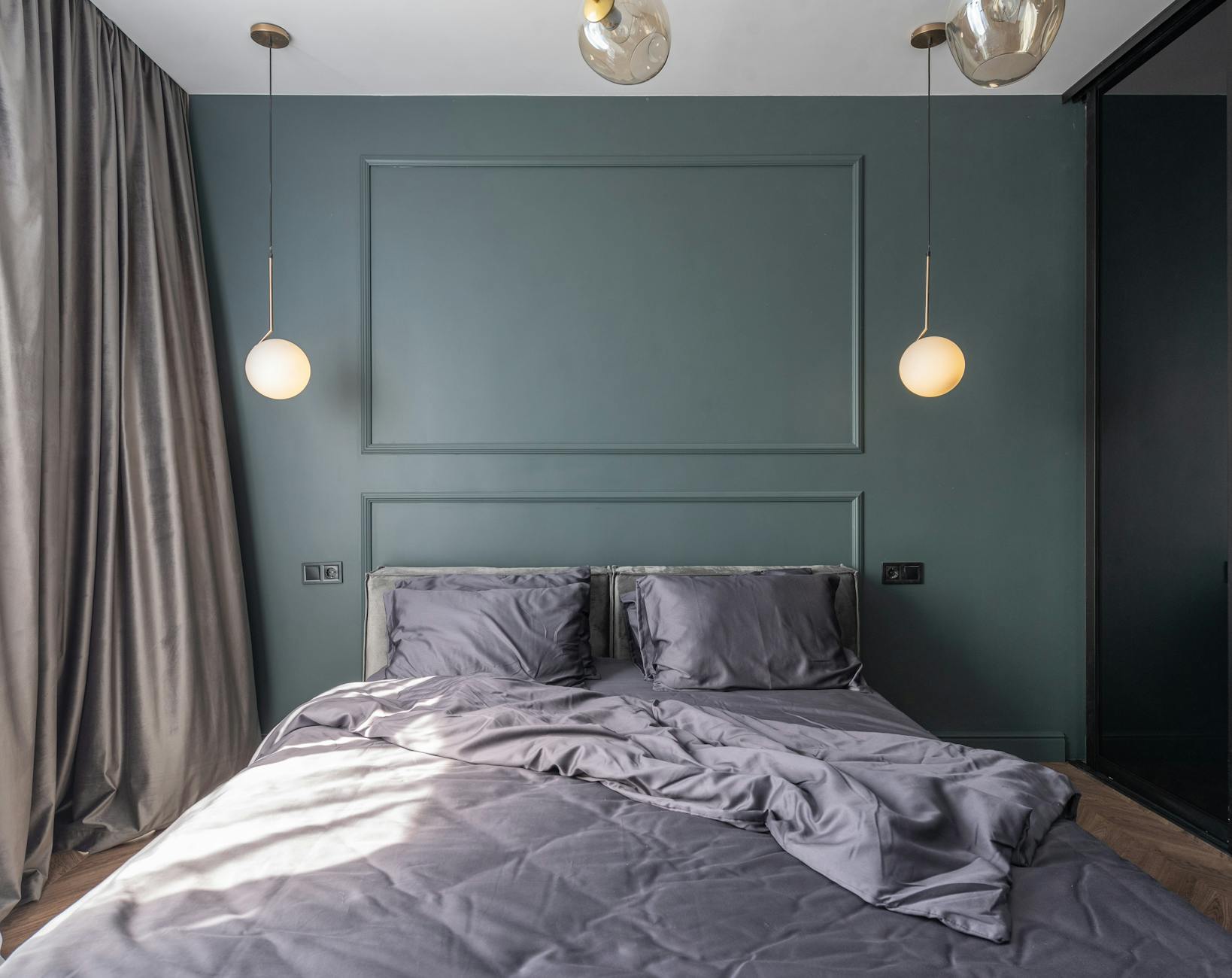 Interior design of modern bedroom with unmade bed and natural light